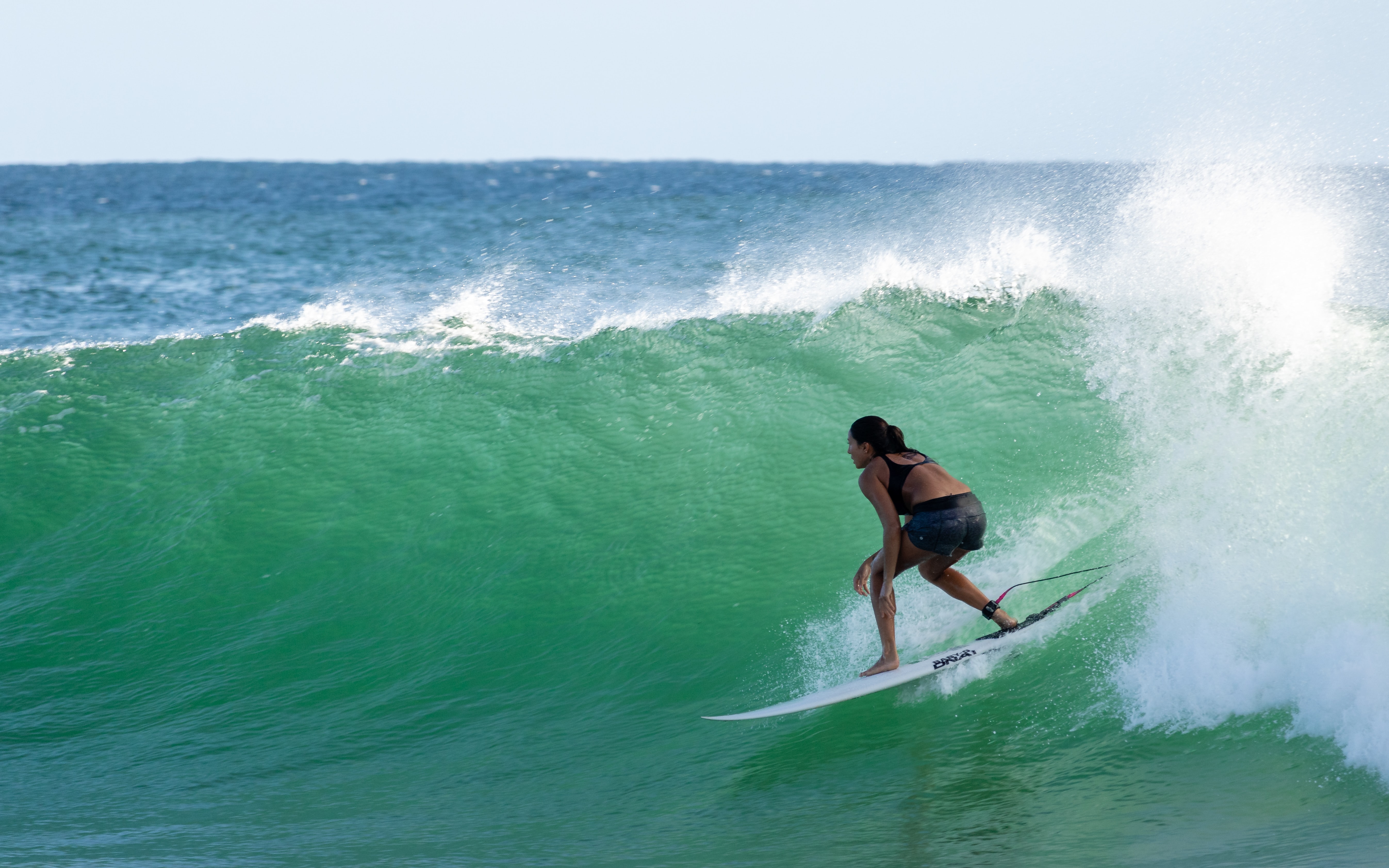 image of woman surfing